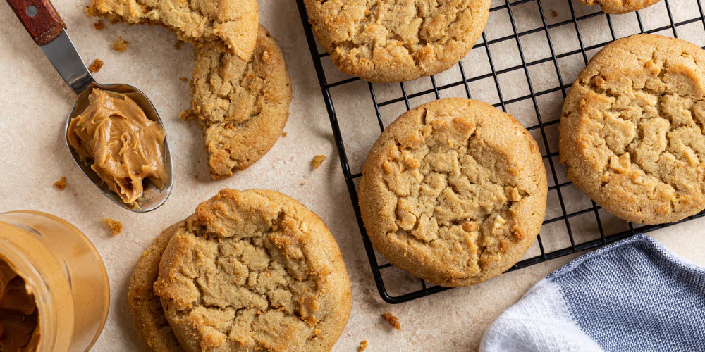 A picture of peanut butter cookies on a baking tray