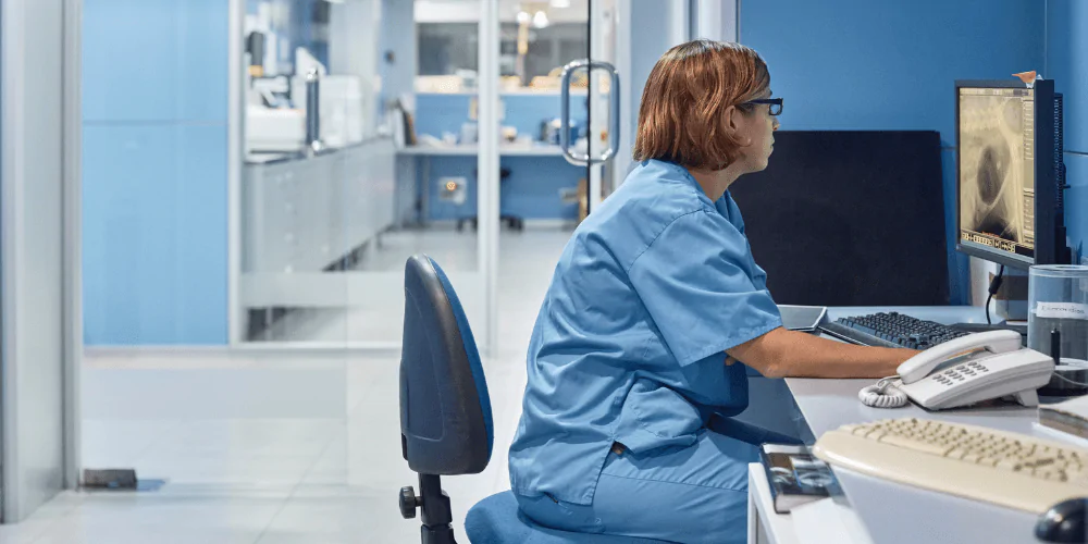 A picture of a vet at her desk