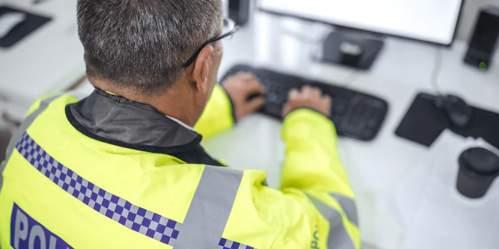 A picture of a police officer at his desk